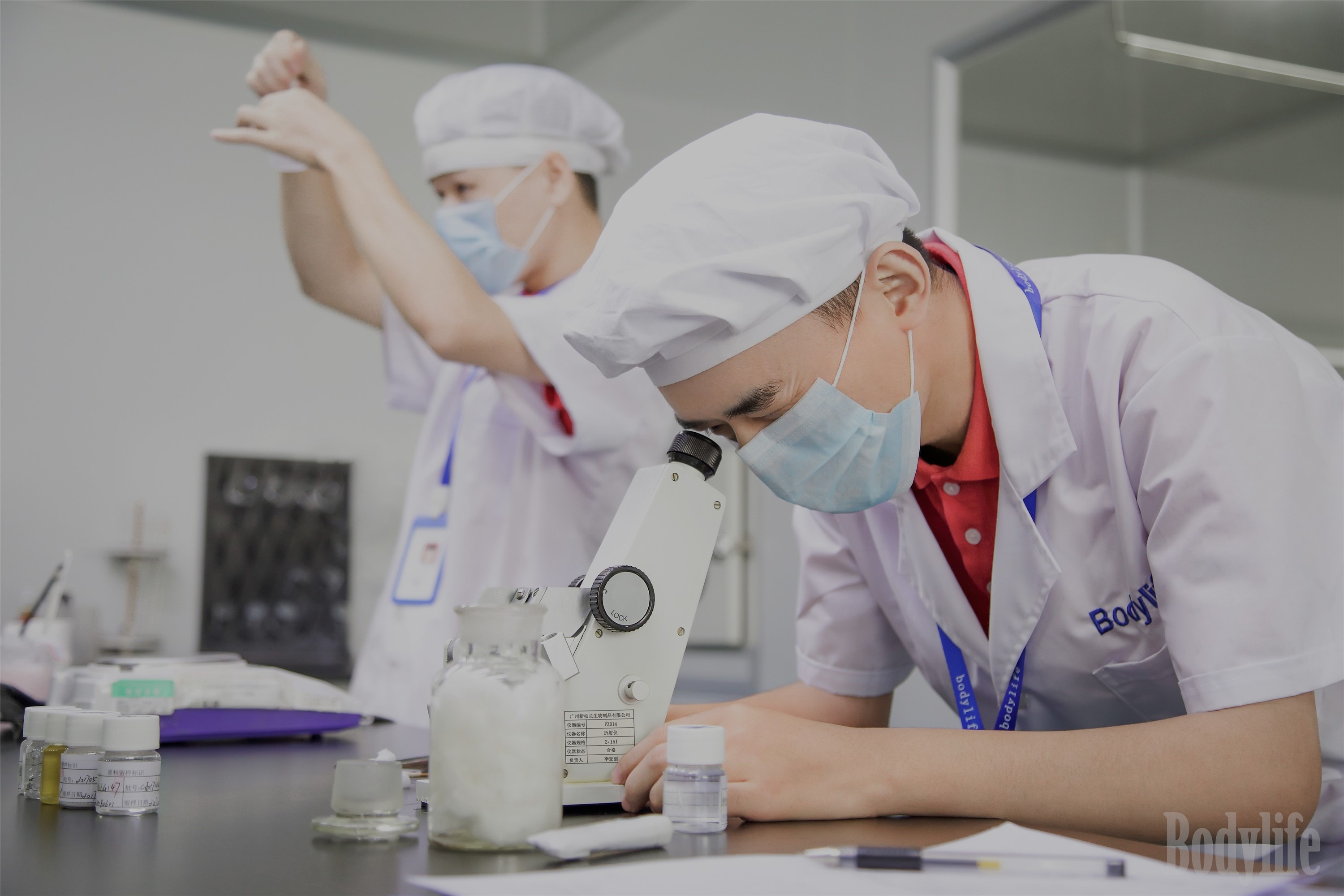 Bodylife R&D scientist at microscope